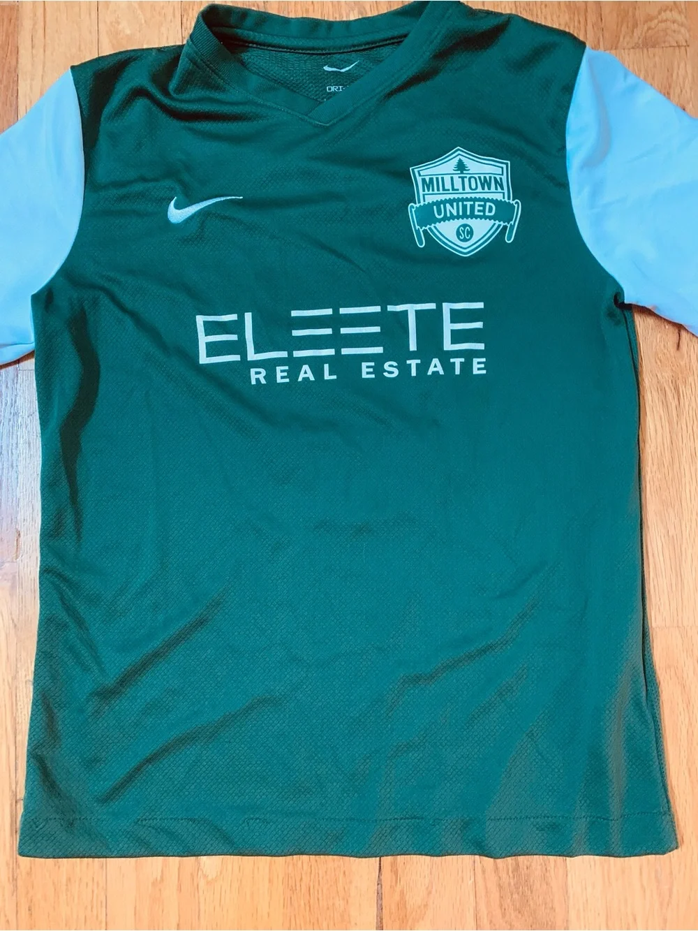 2 Nike Boys L Shirts : Defy Gravity' Nike tee and a green Milltown United jersey